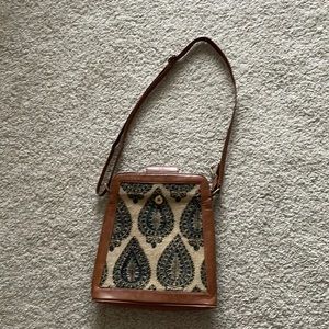 Brown sling bag with jute details